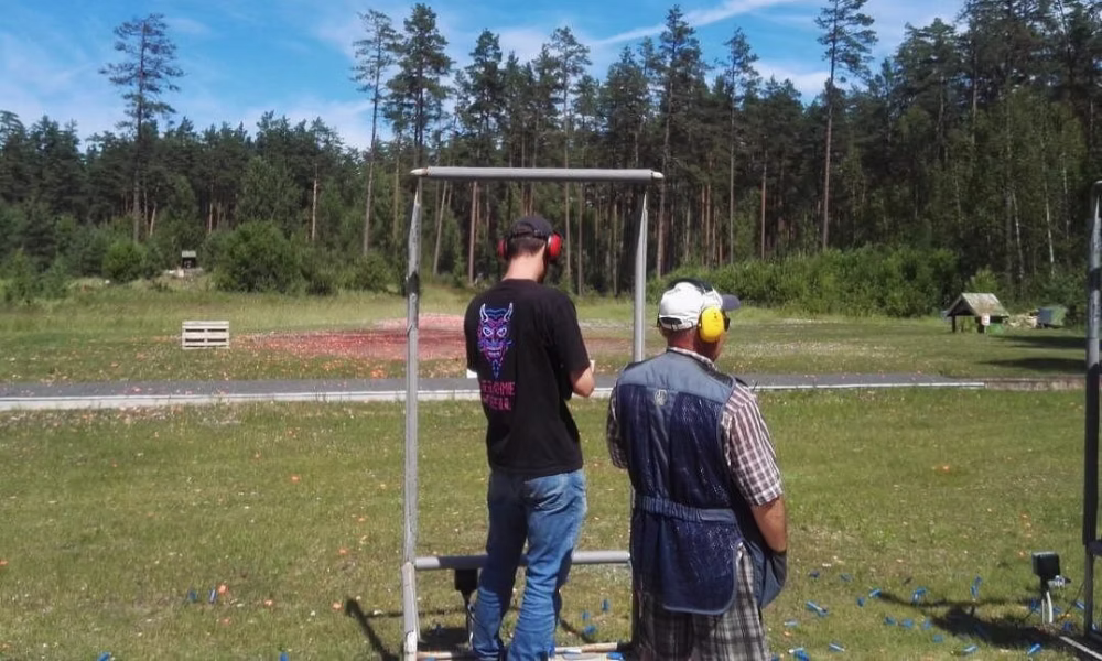 Shooter ready to fire at a clay pigeon target near Riga, Latvia