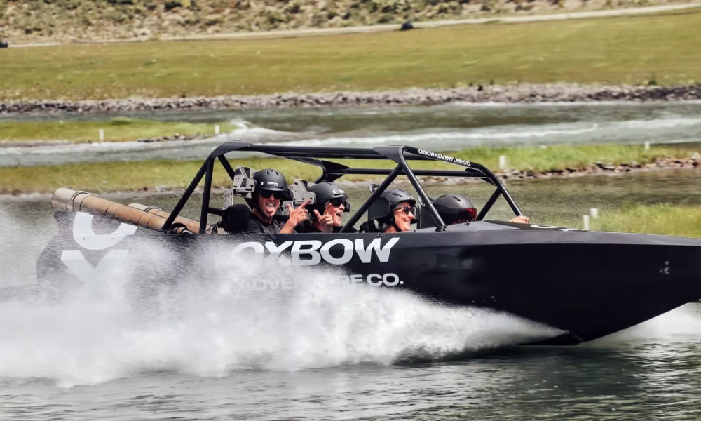 Group of friends on the world's only 4-seater Jet Sprint Boat at Oxbow Adventure Co near Queenstown